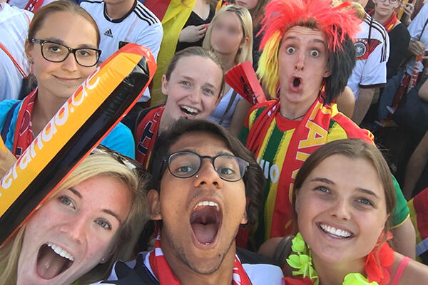 Students cheer for German soccer team in Berlin.