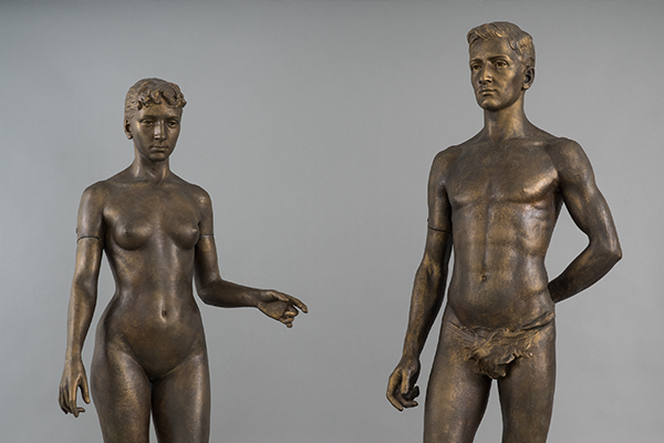 nude male and female life-size statues.