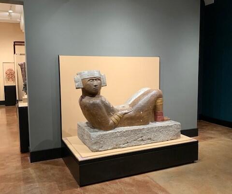 Chac Mool plaster statue in gallery.