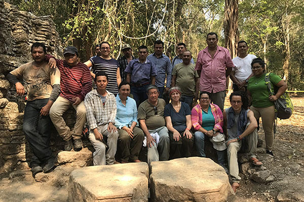 group shot of coworkers at Maya ruins