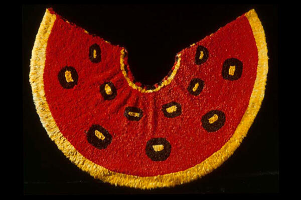 Red and yellow feathered cape from Hawaii