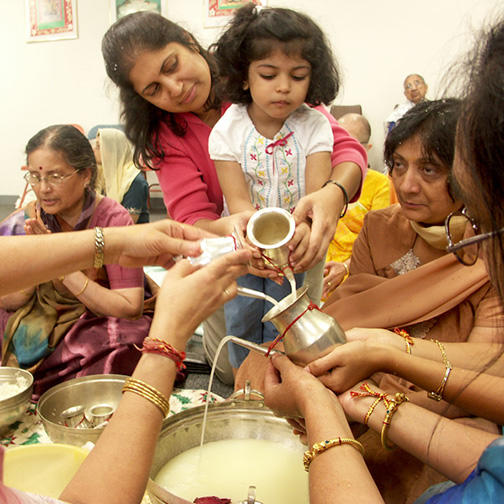 Women of the Sangh Performing Snatra Puja Ablutions