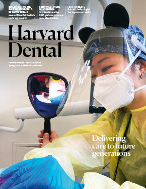 magazine cover with student working with patient
