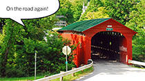 Covered bridge with text On The Road Again