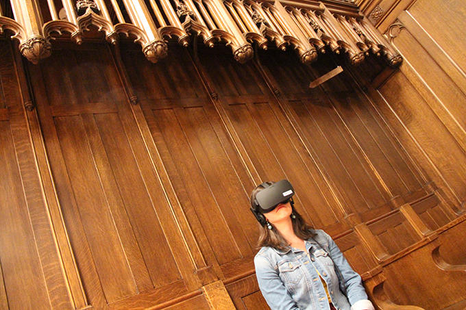 A user tries the When We Die virtual reality experience during an event in Andover Chapel. Photo: Michael Naughton, HDS