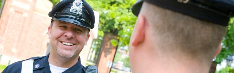 Image of Smiling Police Officer on a Sunny Day