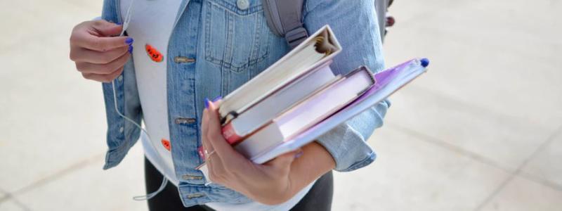 student carrying books