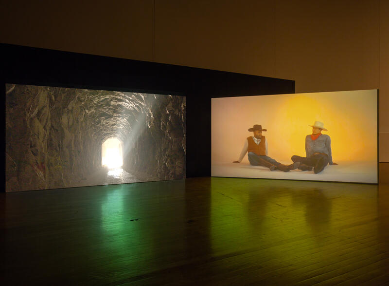 An installation shot of two free standing screens showing Kenneth Tam's work Silent Spikes (2021).