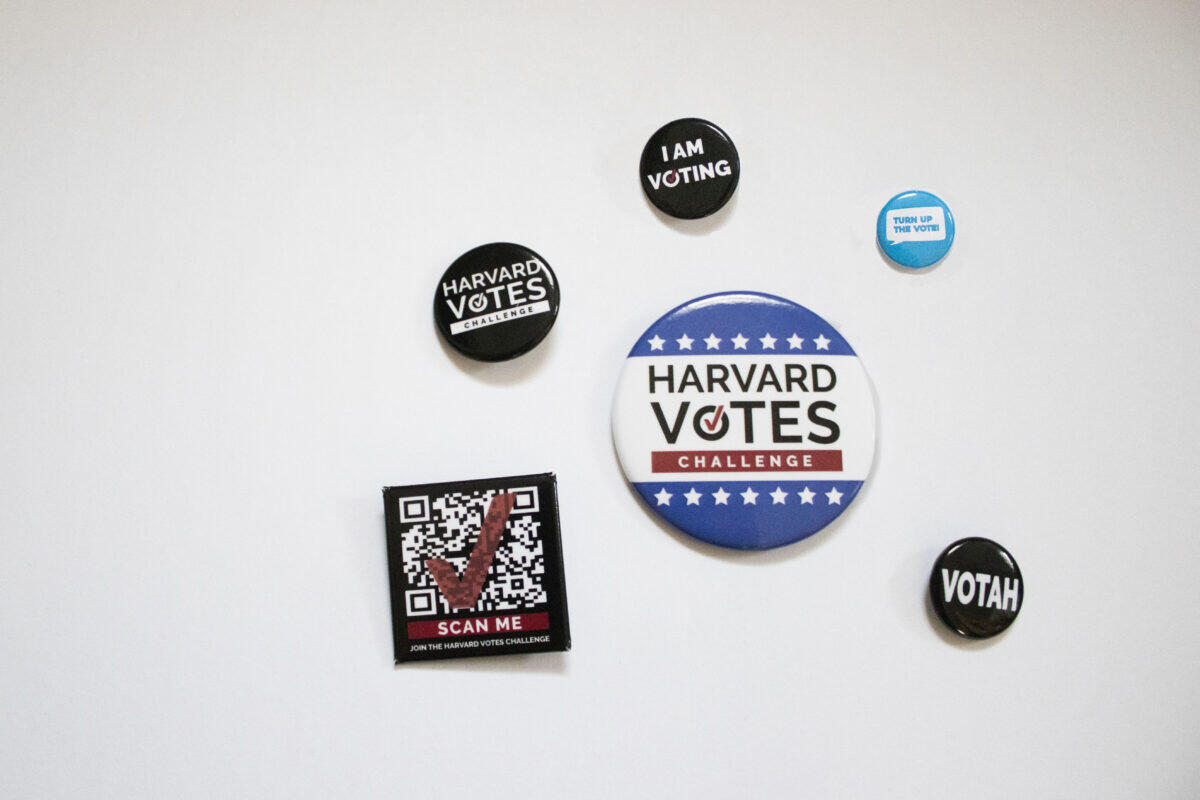 collection of pins written Harvard votes