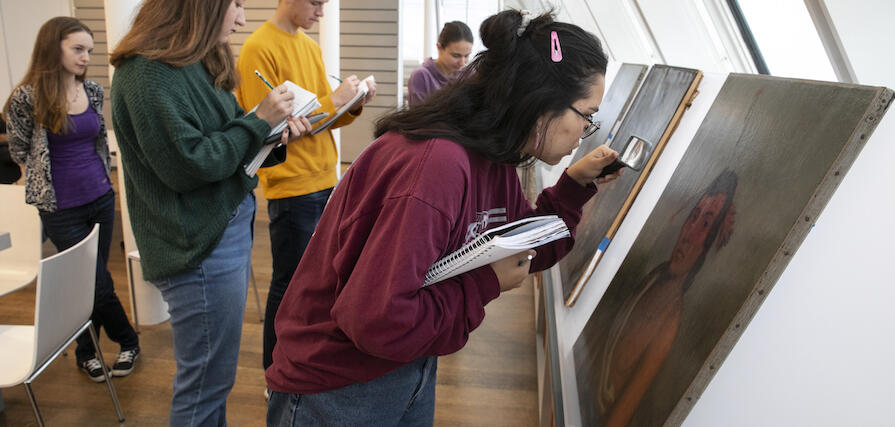 Student examines painting at Harvard Art Museums