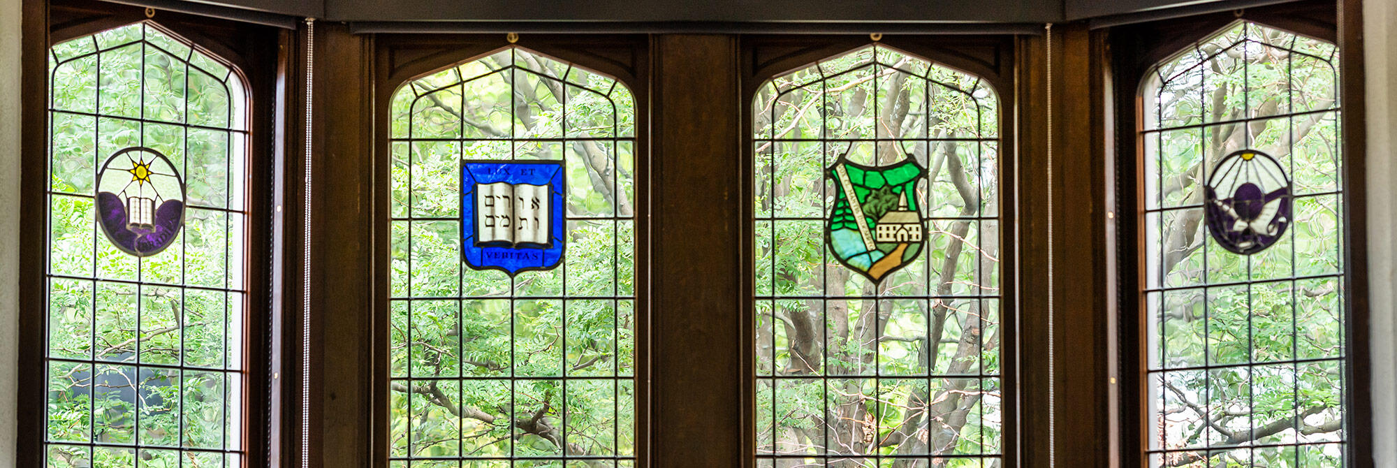 Windows with decorative stained glass emblems
