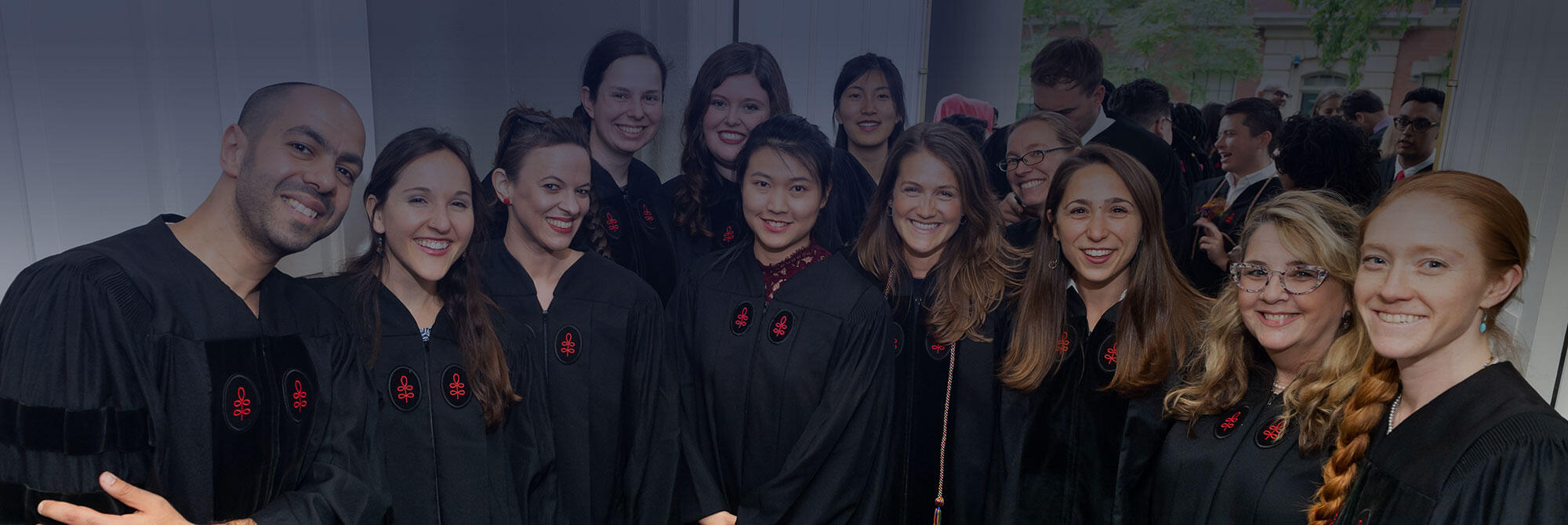 Smiling HDS students pose for a class photo at 2019 Commencement