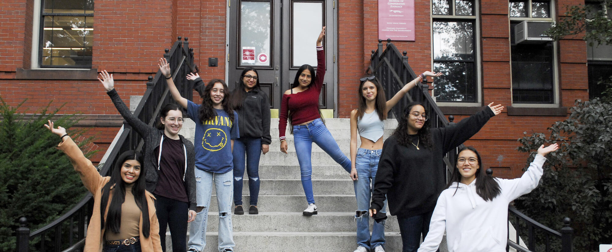 Group of female latina high school students in front of the museum.