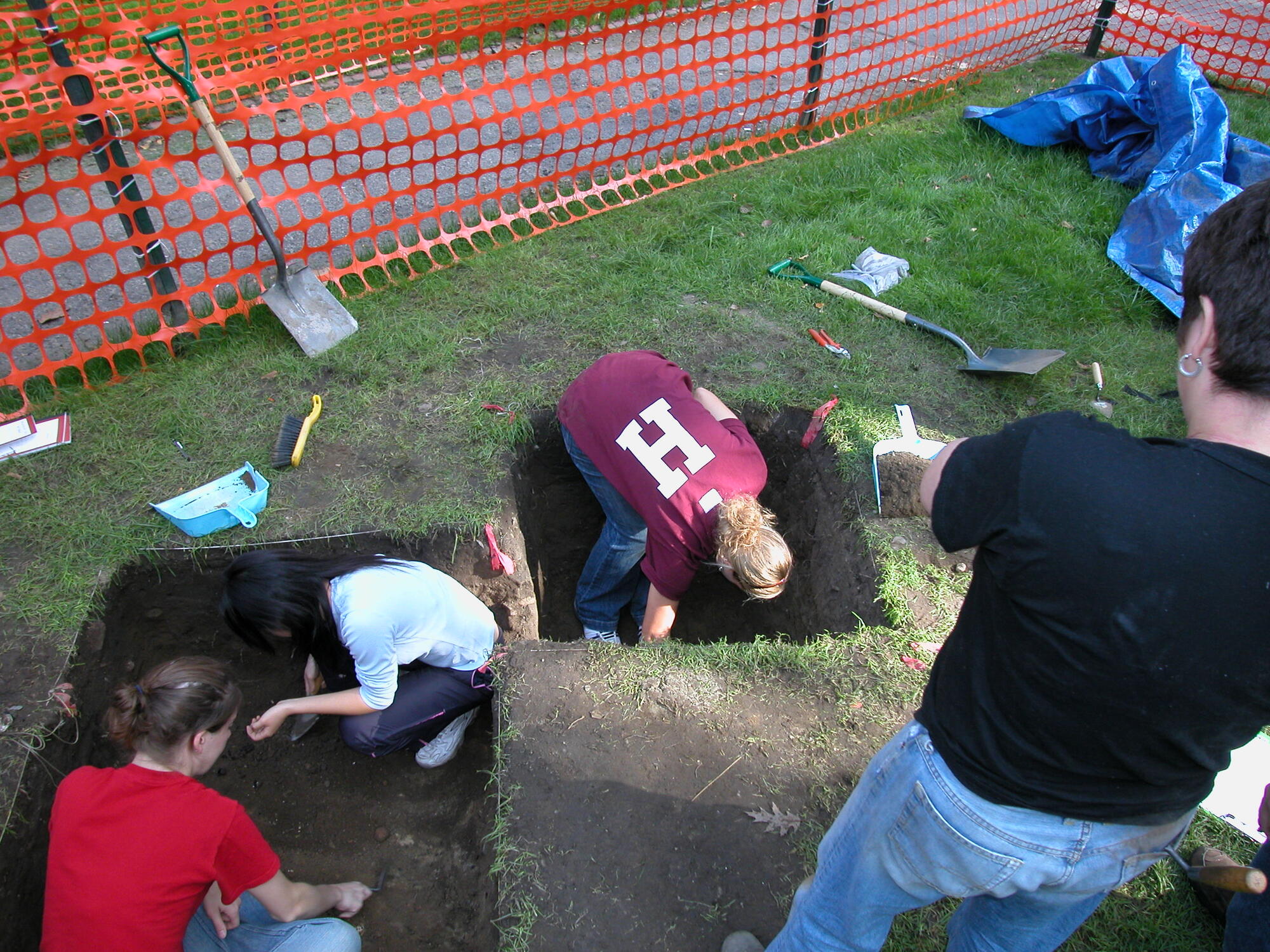 Harvard students doing in the archaeological dig in Harvard Yard.