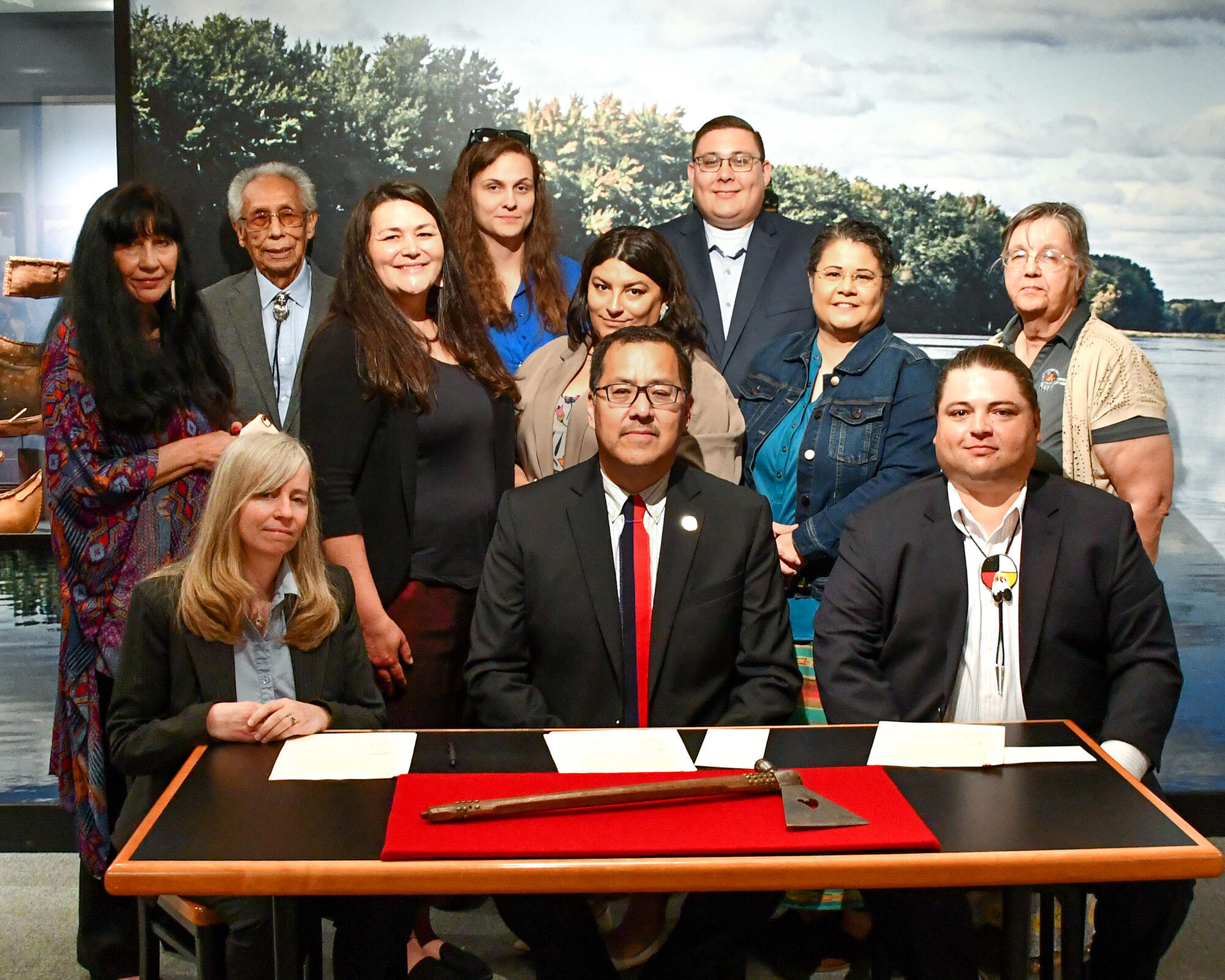 signatories at ceremony to return ponca pipe-tomahawk to tribe.