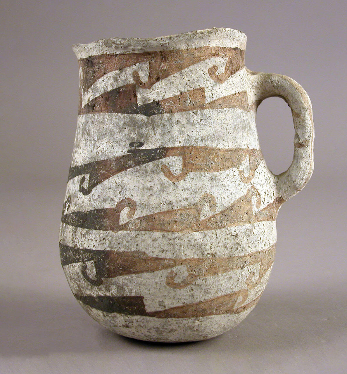 patterned drinking vessel.
