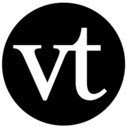 voicethread logo, black circle with white lowercase V and T inside