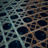 Composite rendering that transitions from a glassy sponge skeleton on the left to a welded rebar-based lattice on the right, highlighting the biologically inspired nature of the research.