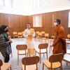 In Harvard Divinity School’s new Swartz Hall, student Minahil Mead (from left), Hindu monk Vandan Ranpurwala, and student and Buddhist monk Mahayaye Vineetha meet in the multifaith space. Photo by Kris Snibbe/Harvard Staff Photographer